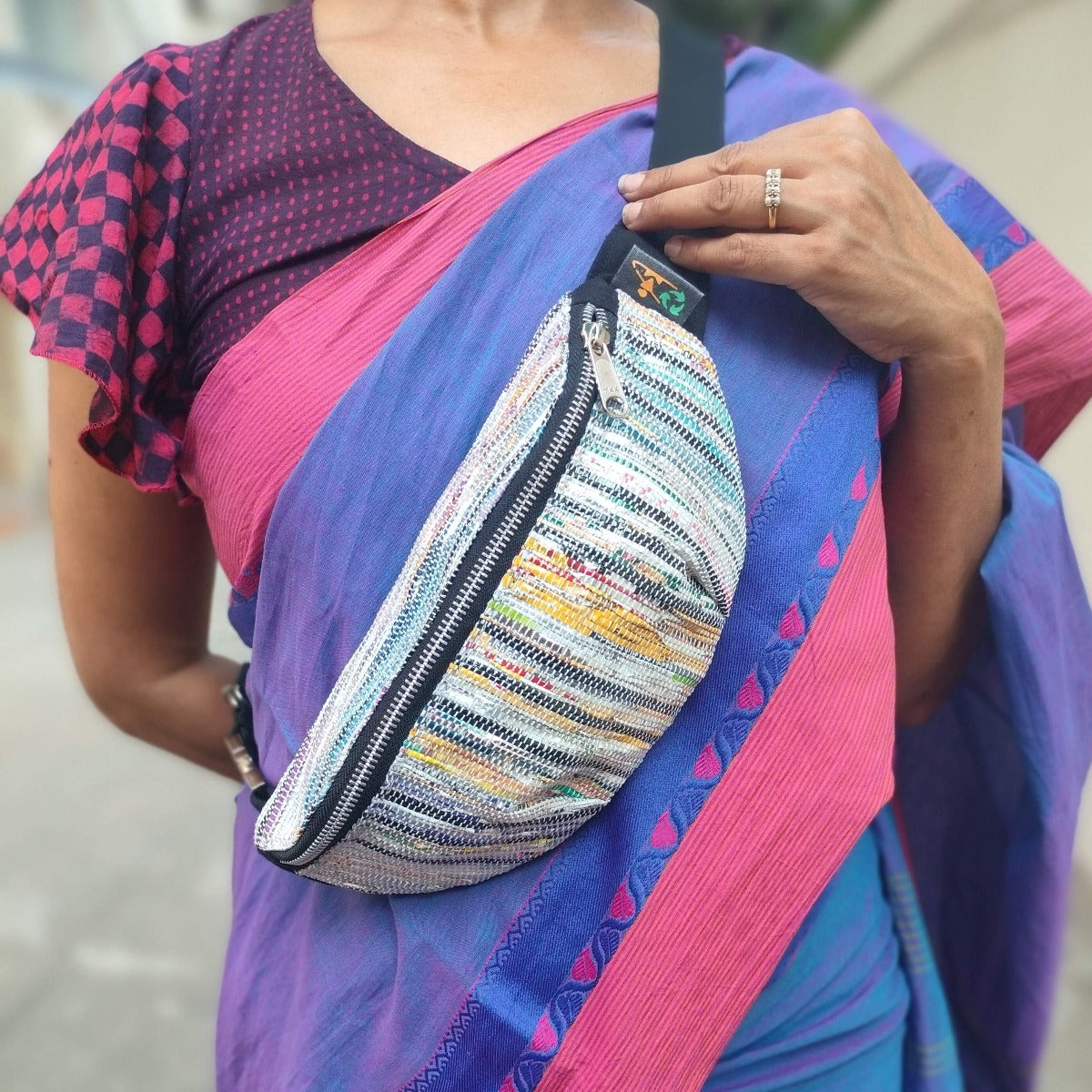 recharkha upcycled handwoven fanny pack waist pouch handmade from waste plastic bags and wrappers and cassette tapes  in India